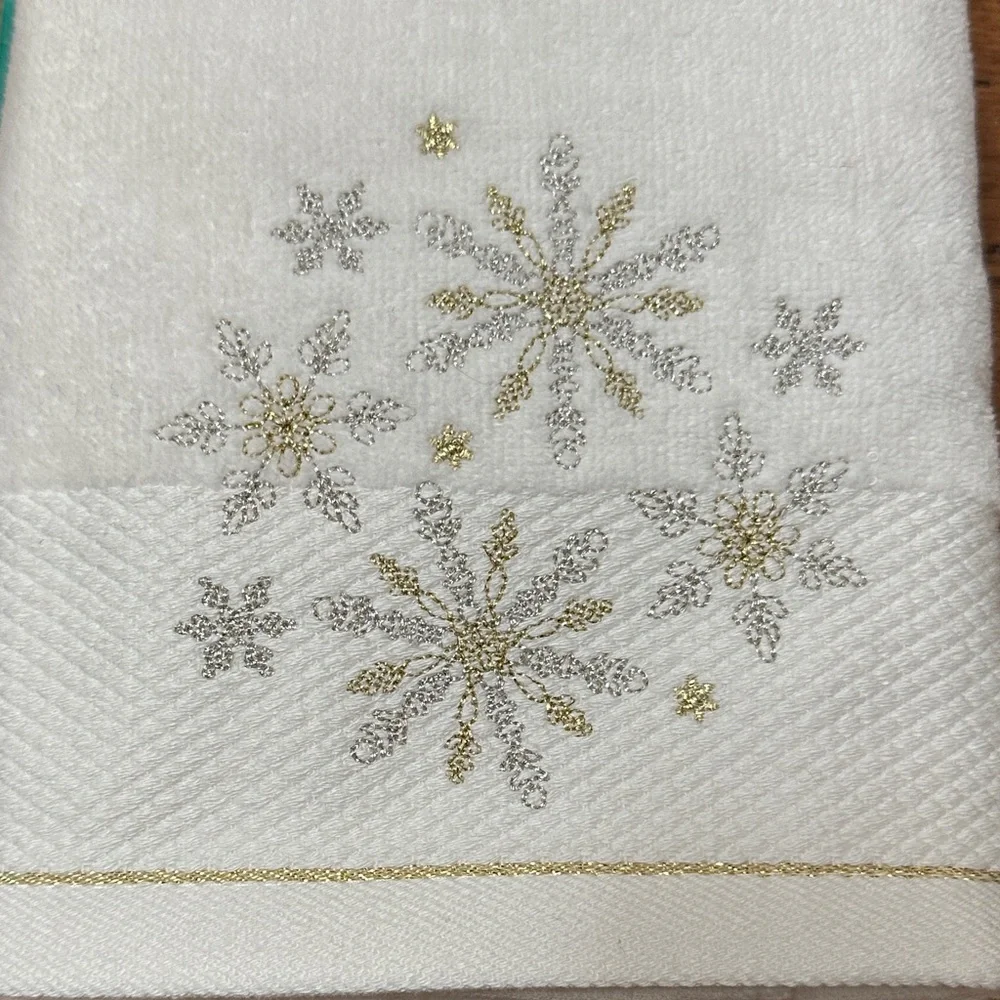 St. Nicholas Square Cream Towels with Silver and Gold Snowflakes